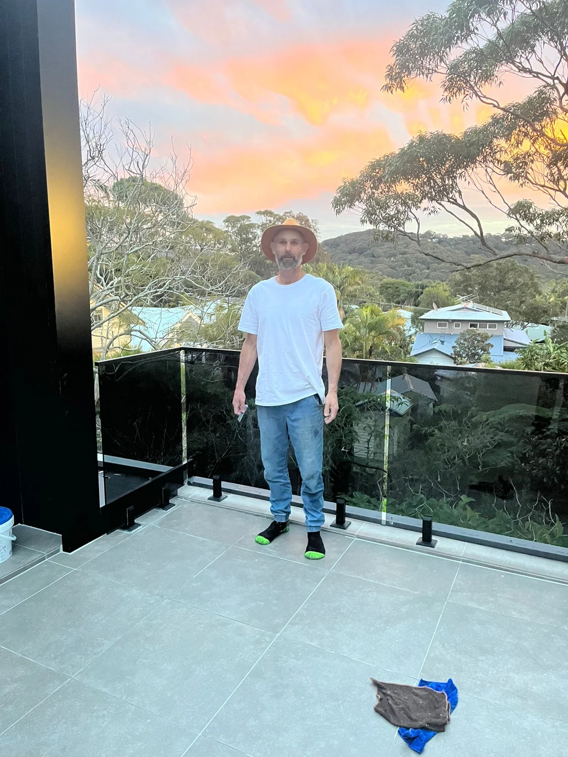 Colin standing on a completed tiled balcony