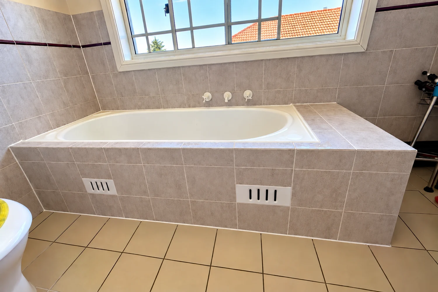 Grey tiled bath restoration