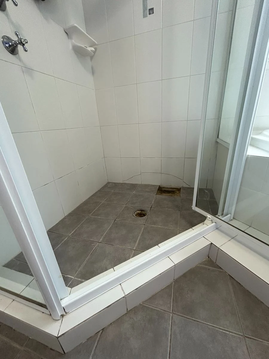 Grey shower before restoration